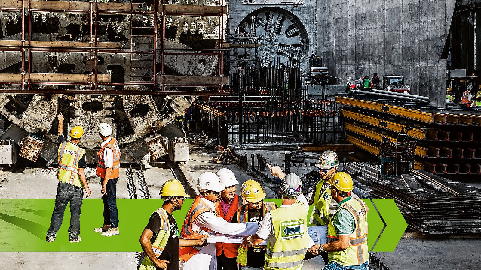 In the foreground, construction site personnel are discussing with a plan in their hands and in the background you can see other employees with two tunnel boring machines